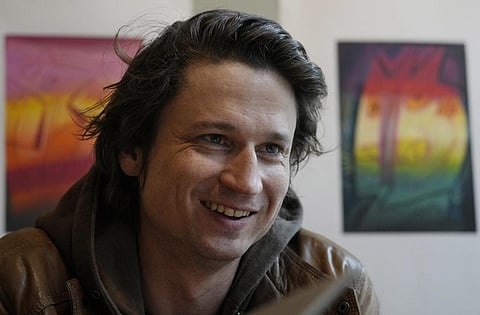 Polish filmmaker Maciek Hamela speaks during an interview in a cafe in Warsaw, Poland, on Wednesday May 17, 2023. (Photo | AP)