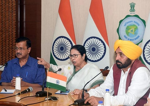 West Bengal Chief Minister Mamata Banerjee with Delhi Chief Minister Arvind Kejriwal and Punjab Chief Minister Bhagwant Mann, in Kolkata, May 23, 2023. (Photo | PTI)