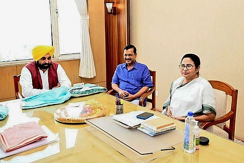 West Bengal Chief Minister Mamata Banerjee with Delhi Chief Minister Arvind Kejriwal and Punjab Chief Minister Bhagwant Mann, in Kolkata, May 23, 2023. (Photo | PTI)