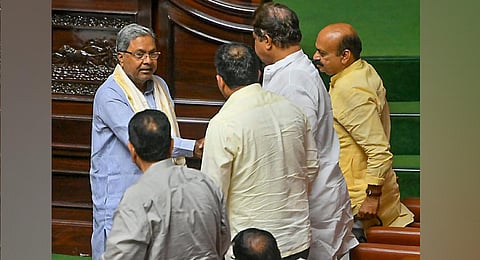 Siddaramaiah with MLAs during the first day of Karnataka Assembly session, in Bengaluru. (Photo | PTI)