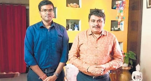 ADG CID Mahesh Bhagwat (right) with Avula Saikrishna who secured rank 94 in Hyderabad on Tuesday