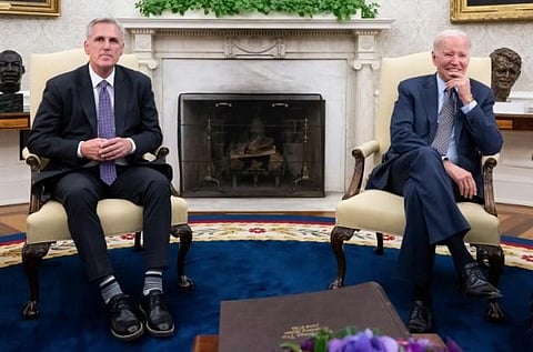 US President Joe Biden (R) meets with US House Speaker Kevin McCarthy about the debt ceiling, in the Oval Office of the White House in Washington, on May 22, 2023. (Photo | AFP)