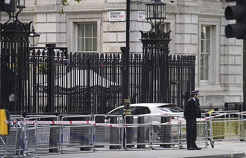 Police at the scene after a car collided with the gates of Downing Street in London on Thursday (Photo | AP)