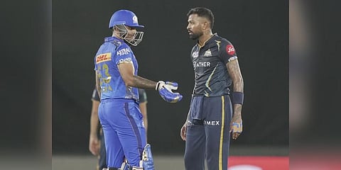 GT' Hardik Pandya and MI batter Suryakumar Yadav during the IPL 2023 cricket playoff match at the Narendra Modi Stadium, in Ahmedabad. (Photo | PTI)