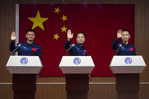 Chinese astronauts for the upcoming Shenzhou-16 mission, (From L) Gui Haichao, Jing Haipeng, and Zhu Yangzhu at the Jiuquan Satellite Launch Center in northwest China, May 29, 2023. (Photo | AP)