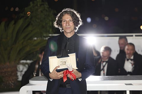 Jonathan Glazer, winner of the jury prize award for 'The Zone of Interest', poses during a photo call following the awards ceremony at the 76th international film festival, Cannes. (AP)
