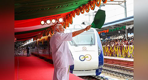 Prime Minister Narendra Modi seen flaggging off Kerala's first Vande Bharat Express, in Thiruvananthapuram. (Photo | PTI)
