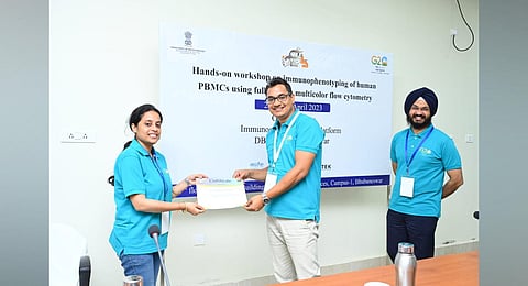 A participant receiving certificate after completion of training at ILS.