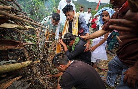 Family members perform rituals during the last rites of Deepu Kumar who was shot dead by terrorists in Anantnag district on Monday, in Udhampur district, on May 30, 2023. (PTI)