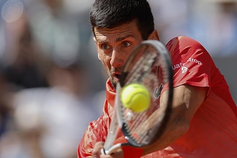 Serbia's Novak Djokovic plays a shot against Aleksandar Kovacevic of the U.S. during their first round match of the French Open tennis tournament at the Roland Garros stadium. (Photo | AP)