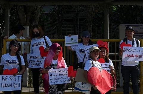 In this photo taken on February 14, 2023 shows pro-divorce protesters taking part in a demonstration on Valentine's Day in front of the Senate Building in Pasay, Metro Manila. (Photo | AFP)