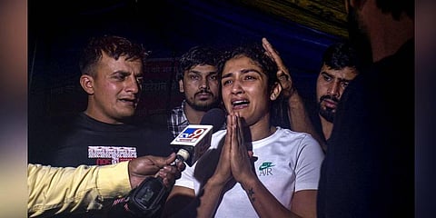 Sangita Phogat reacts while talking to the media after an scuffle between wrestlers and the police at Jantar Mantar, in New Delhi. (Photo | PTI)