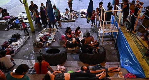 People gather at a shelter in a sports center after fleeing from their village affected by Fuego volcano in Santa Lucia Cotzumalguapa, Escuintla south of Guatemala City. (Photo | AFP)