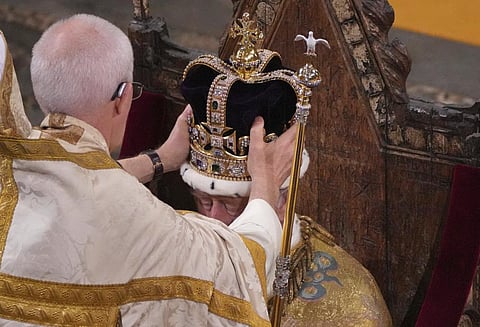 Britain's King Charles III is crowned with St Edward's Crown by The Archbishop of Canterbury Justin Welby during his coronation ceremony in Westminster Abbey, London, May 6, 2023. (Photo | AP)
