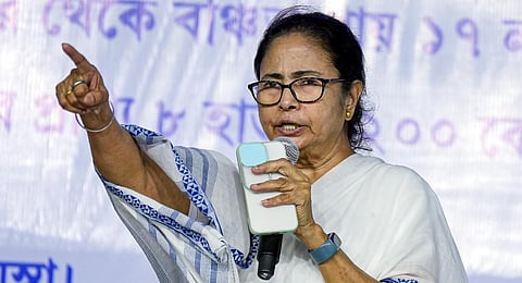 West Bengal Chief Minister and TMC supremo Mamata Banerjee speaks at the end of the party's sit-in demonstration near BR Ambedkar statue at Red Road. (Photo | PTI)