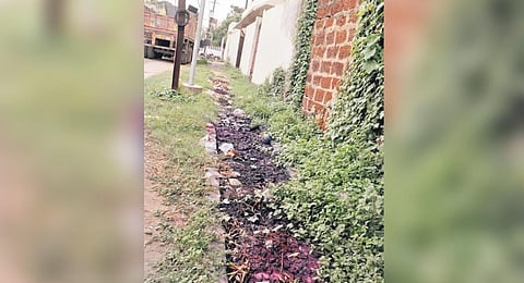 A clogged drain in Mancheswar industrial estate | Express