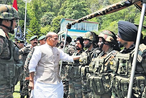 Defence minister Rajnath Singh meets soldiers during his visit to the Army Base Camp at Rajouri in Jammu & Kashmir on Saturday. (Photo | PTI)