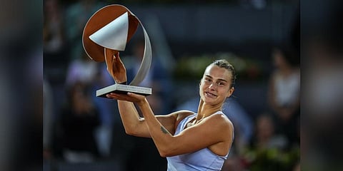 Belarus' Aryna Sabalenka holds the winner's trophy after defeating Iga Swiatek of Poland at the end of the women's final at the Madrid Open tennis tournament in Madrid on May 6, 2023 | AP