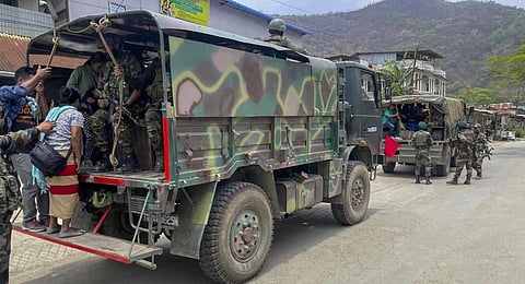 Army personnel rescue people from a violence-hit area of Manipur. (Photo | PTI)
