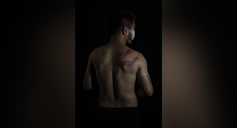 Afghan journalist Neamatullah Naqdi, 28, poses for a portrait at Etilaat Roz daily office in Kabul, Afghanistan, Friday, Sept. 10, 2021. (File photo | AP)