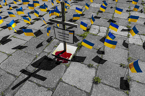Activists set up an installation representing Russian atrocities against Ukraine, in Warsaw, Poland, on Tuesday May 9, 2023. ( Photo | AFP )