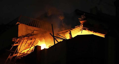 Fire burns at an apartment of an Islamic Jihad commander for northern Gaza, following Israeli airstrikes in Gaza City. (Photo | AP)