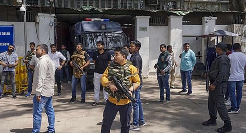 Security personnel stand guard outside Patiala House Court, where four accused in Tillu Tajpuriya murder case were produced, in New Delhi. (Photo | PTI)