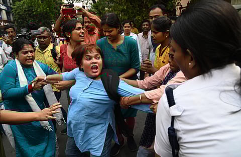 Congress supporters during their protest in front of West Bengal State Election Commission office. (Photo | PTI)