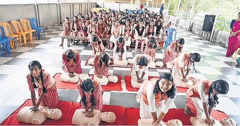 Children getting training in CPR as part of the inauguration of IHNA Australia Health Project at Thiruvallam VHSS in Thiruvananthapuram on Friday