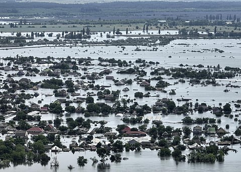 Houses are seen underwater in the flooded town of Oleshky, Ukraine, Saturday, June 10, 2023. (Photo | AP)
