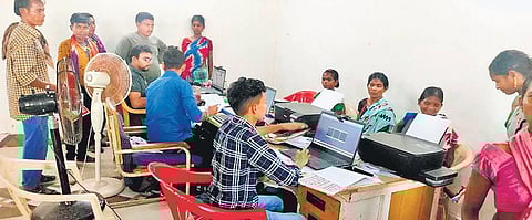 Bastar tribals in Gampur village receive their voter ID card. (Photo | Express)