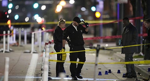 Denver Police Department investigators work the scene of a mass shooting. (Photo | AP)