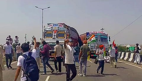 Farmers block the national highway- 44 during their protest demand for government procurement of sunflower seeds at MSP, in Kurukshetra, Monday, June 12, 2023. (Photo | PTI)