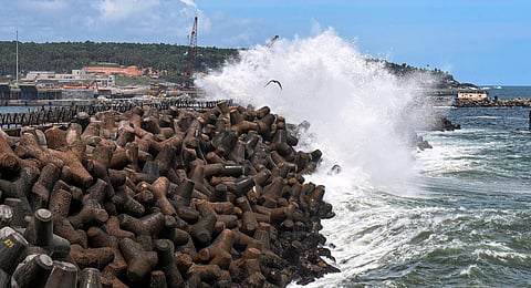 High tidal waves crash on the shore at the Vizhinjam harbour in Thiruvananthapuram. (Photo | PTI)