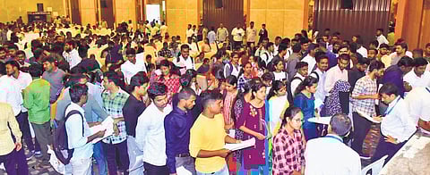 Young job aspirants queue up for registration during a special recruitment drive for the IT hub in Siddipet on Tuesday