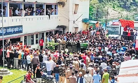 Leaders of Hindu organisations protest before Barkot tehsil in Uttarkashi. (Photo | Express)