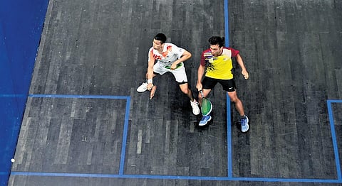 India’s Saurav Ghosal in action against Malaysia’s Darren Pragasam on Friday | M ravikumar