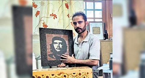 Manzoor Ahmed Bhat with his mosaic art.
