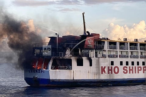 smoke comes out from Philippine ferry M/V Esperanza Star as it caught fire at the waters off Panglao, Bohol province, central Philippines. (Photo | AP)