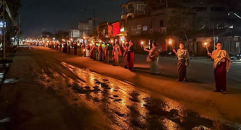 Women form a human chain to protest against the ethnic violence between the Meitei and Kuki community in Manipur