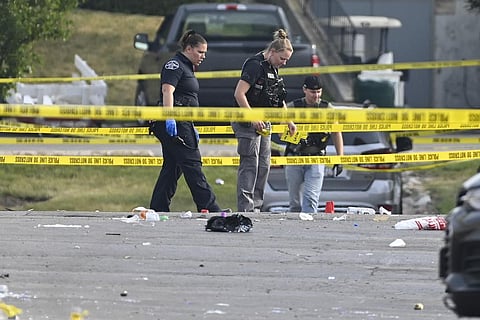 Investigators look over the scene of an overnight mass shooting at a strip mall in Willowbrook, Ill., Sunday, June 18, 2023. (Photo | AP)
