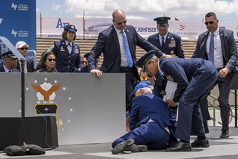 President Joe Biden falls on stage during the 2023 United States Air Force Academy Graduation Ceremony at Falcon Stadium. (Photo | AP)