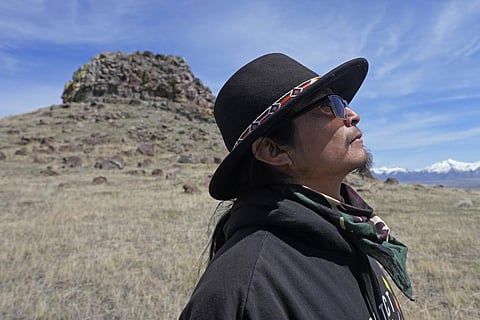 Gary McKinney, a spokesman for People of Red Mountain and a member of nearby Duck Valley Shoshone-Paiute Tribe, walks near Sentinel Rock on April 25, 2023. (Photo | AP)