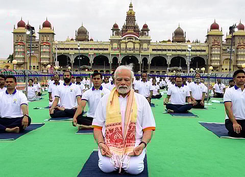 Prime Minister Narendra Modi practices Yoga during the International Yoga Day celebration at Mysuru Palace in 2022 (Photo | Udayshankar S, EPS)