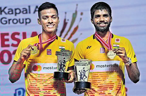 Satwiksairaj Rankireddy (Right) and Chirag Shetty beat the Malaysian pair of Aaron Chia and Soh Wooi Yik in the final of the Indonesia Open on Sunday.(Photo | AP)