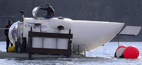 OceanGate CEO Stockton Rush emerges from the hatch atop the OceanGate submarine Cyclops 1 in the San Juan Islands, Wash., on Sept. 12, 2018. (Photo | AP)