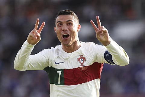 Portugal's Cristiano Ronaldo celebrates after scoring his side's first goal during the Euro 2024 group J qualifying soccer match between Iceland and Portugal. (Photo | AP)