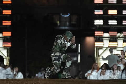 Designer Pharrell Williams accepts applause at the conclusion of the Louis Vuitton Menswear Spring/Summer 2024 fashion collection. (Photo | AP)