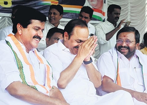 Leader of Opposition V D Satheesan shares a light moment with Congress leaders V S Sivakumar and Sarath Chandraprasad on Tuesday during the inauguration of the UDF dharna against the state government