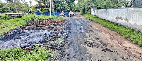 The sediments removed from the Kuzhikandam canal deposited on the roadsides and nearby fields in Eloor